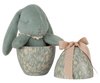 The PRE-ORDER: Maileg Easter Egg With Bunny - Mint features a soft, teal plush bunny made from recycled polyester inside a botanical-patterned egg-shaped container, with a matching lid tied with a beige bow. (Ships in February).