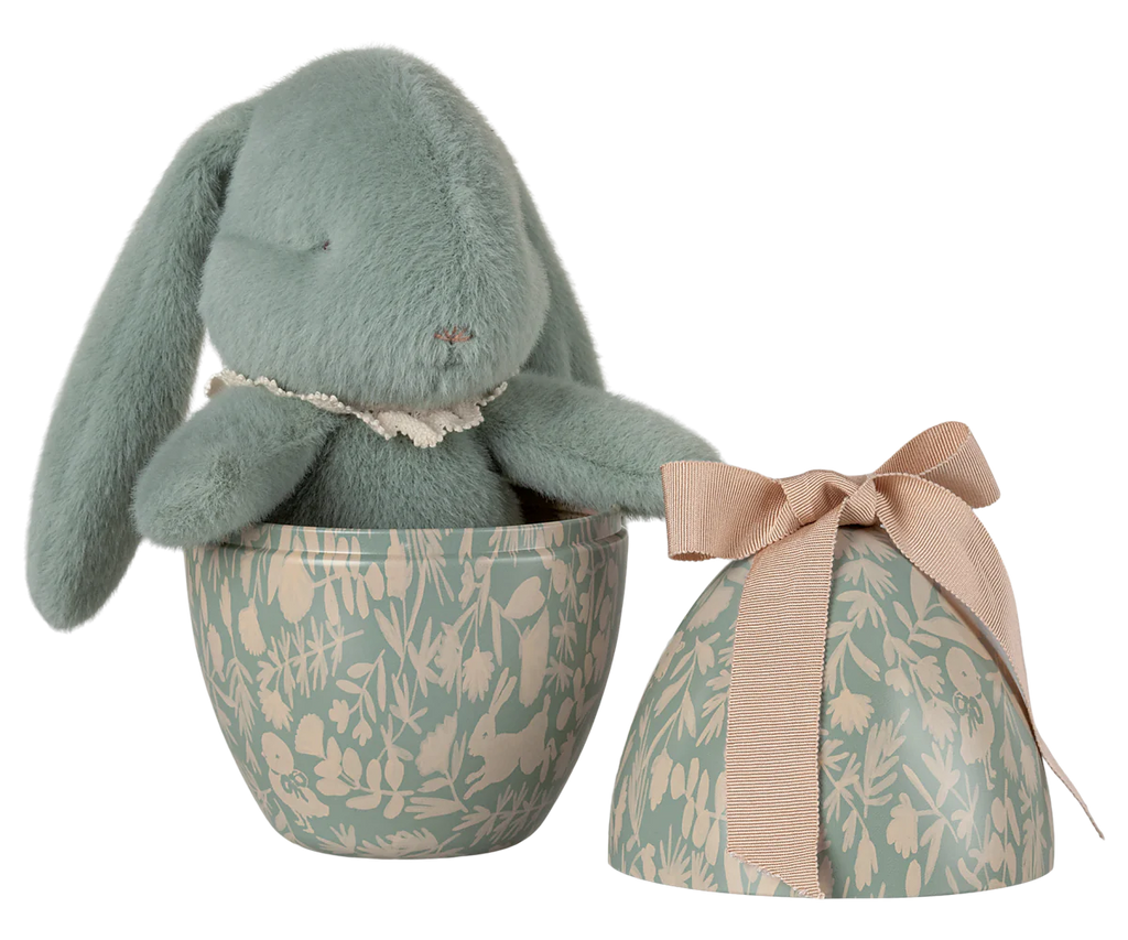 The PRE-ORDER: Maileg Easter Egg With Bunny - Mint features a soft, teal plush bunny made from recycled polyester inside a botanical-patterned egg-shaped container, with a matching lid tied with a beige bow. (Ships in February).