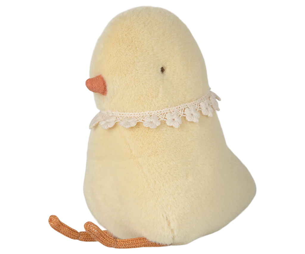 The PRE-ORDER: Maileg Easter Egg With Chick features a plush chick toy with creamy yellow recycled polyester fur, an orange beak, small black eyes, and a lace collar. Safe for all ages, it sits upright with visible orange feet. Ships in February.