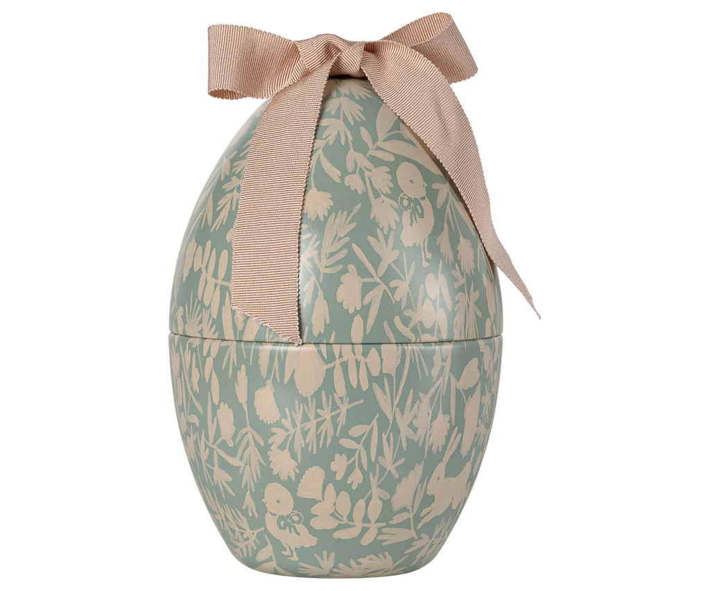 The Maileg Easter Egg - Mint is a decorative metal container with a white floral pattern on a light green background, featuring a textured pink ribbon bow. Available for pre-order, ships in February.