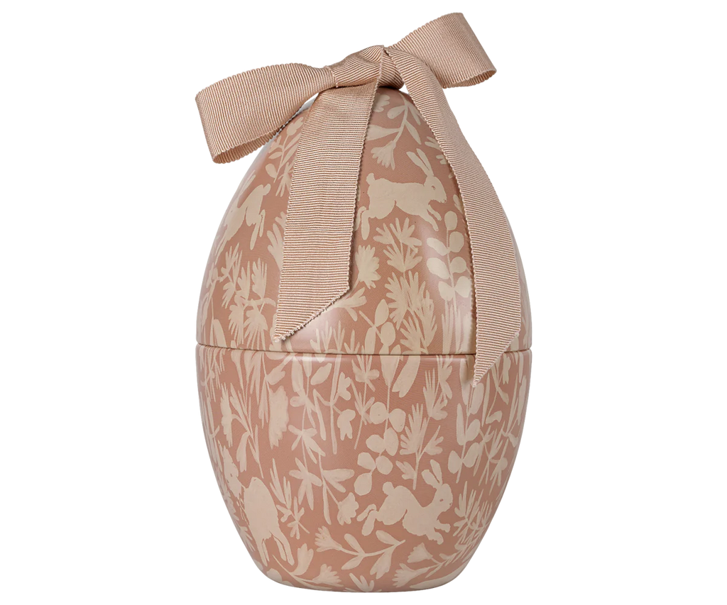 The Maileg Easter Egg - Powder is a decorative egg-shaped container with a floral pattern in beige tones, featuring a textured metal surface and topped with a ribbon bow for an exclusive look.