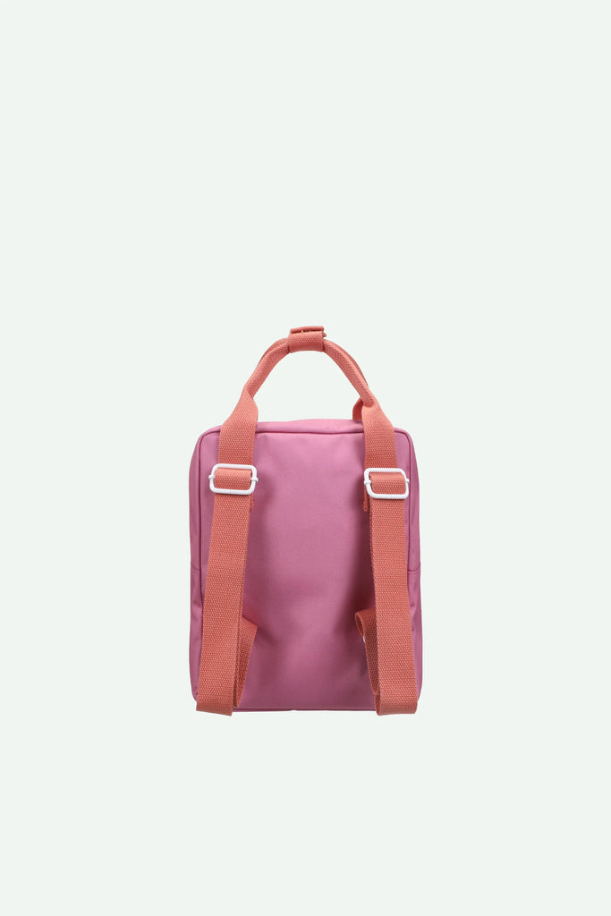 A Sticky Lemon Backpack Small - Envelope - Rosebay Pink, crafted from recycled PET bag materials with peach adjustable shoulder straps and a matching top handle, photographed against a plain light background.
