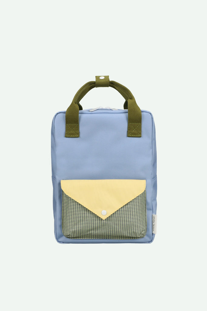 A medium-sized Sticky Lemon backpack in cloud blue, made from recycled PET bottles, featuring olive green handles and a front pocket with a yellow envelope-style flap and checkered pattern.