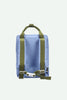 A Sticky Lemon Backpack Medium | Envelope in Cloud Blue, made from recycled PET with a rectangular shape, features green adjustable shoulder straps and a matching green handle, displayed against a plain white background.