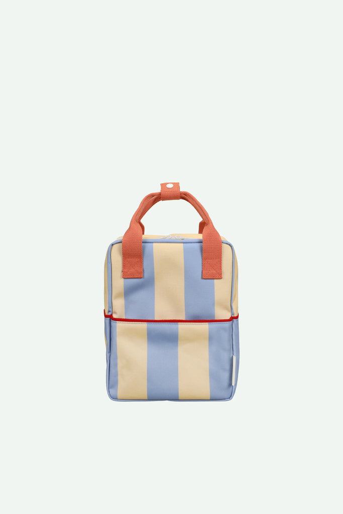 The Sticky Lemon Backpack Small | Stripes | Cloud Blue + Twiggy Beige is a kids’ square backpack made from recycled PET, with vertical yellow and light blue stripes, orange handles, a front pocket with red zipper, and a light background.