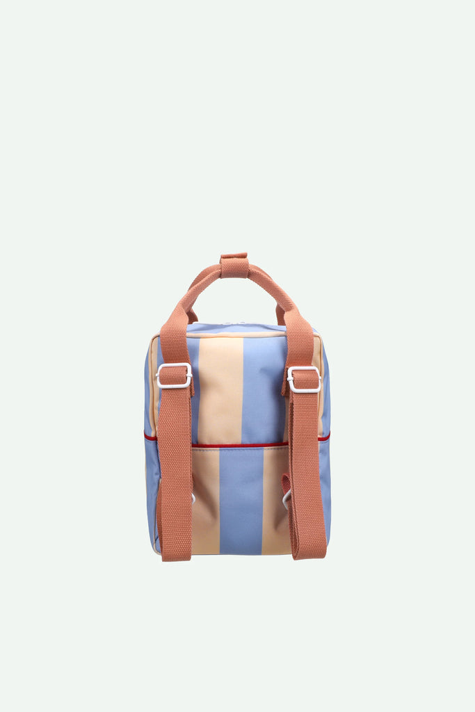 The Sticky Lemon Backpack Small | Stripes | Cloud Blue + Twiggy Beige features blue and beige vertical stripes, orange-brown adjustable straps, a top handle, and is made from recycled PET bottles. This waterproof kids backpack is shown on a light background.
