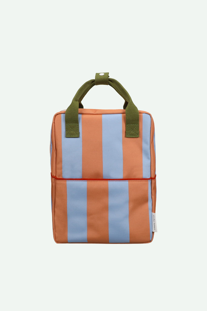 Sticky Lemon Backpack Medium | Stripes | Cloud Blue + Maple Whirl—a square-shaped medium backpack adorned with vertical orange and light blue stripes, equipped with two green handles and a white side tag. Crafted from recycled PET bottles with a waterproof lining, displayed against a plain light background.