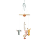 The Maileg Lullaby Friends Mobile features plush elephant, giraffe, and lion figures in pastel colors and soft fabrics, suspended from a circular wooden frame with a ribbon for hanging.