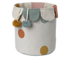 Introducing the Maileg Basket, a delightful cotton linen basket that showcases a whimsical design with colorful polka dots and elegant scalloped edges, ideal for storing toys. This charming piece is embellished with two hanging pom-poms in yellow and teal. The soft pastel hues of pink, mustard, and muted teal evoke the enchanting style of the original Maileg Basket.