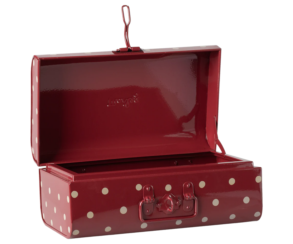The Maileg Storage Suitcase - Red with Dots is a playful rectangular metal suitcase with white polka dots, an open lid, handle, and latch—ideal as a charming storage or decorative piece.