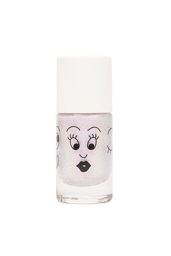 A Nailmatic nail polish bottle with a cartoon face featuring eyes with eyelashes and a puckered mouth, filled with sparkling opalescent, water-based nail polish. The cap is plain white.