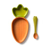 Introducing the Cathy the Carrot Plate & Spoon Set: an adorable baby tableware collection featuring a Hevea wood plate shaped like a carrot and a coordinating green and orange spoon, both made from non-toxic dinnerware materials, beautifully set against a white background.