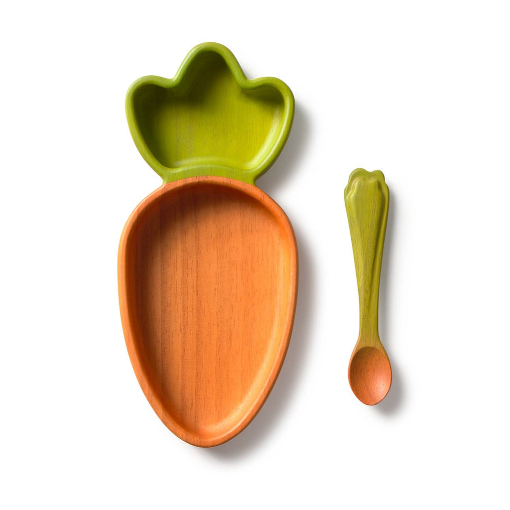 Introducing the Cathy the Carrot Plate & Spoon Set: an adorable baby tableware collection featuring a Hevea wood plate shaped like a carrot and a coordinating green and orange spoon, both made from non-toxic dinnerware materials, beautifully set against a white background.