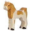 The Holztiger Goat, a handcrafted wooden figure from the HOLZTIGER collection, showcases a painted light brown and white body with black-tipped hooves and simple facial features, standing upright against a plain white background.