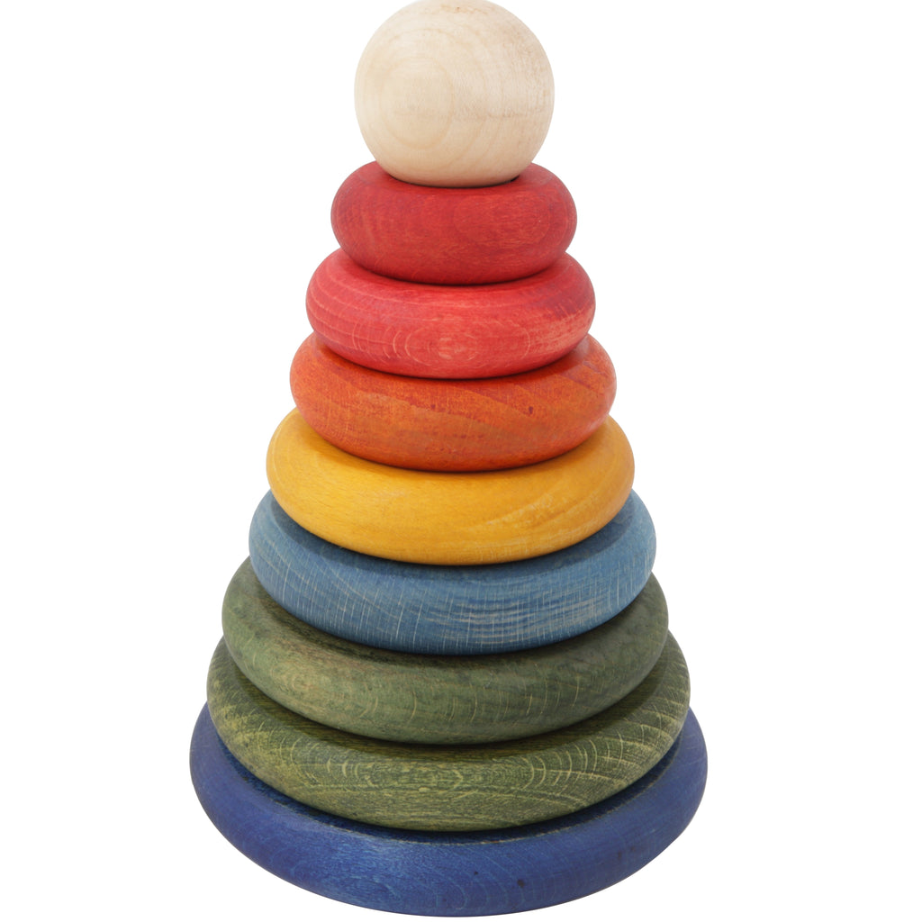 A colorful Rainbow Wooden Stacker with rings in various sizes and colors arranged in descending order from largest at the base to smallest at the top on a white background.