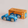 A blue wooden race car, No. 5 GT30 Coby, made in England and featuring the number 93, is displayed in front of its orange box labeled “GT30 COBY” and “Limited Edition.” The packaging showcases an illustration of this sustainable classic racing toy car.