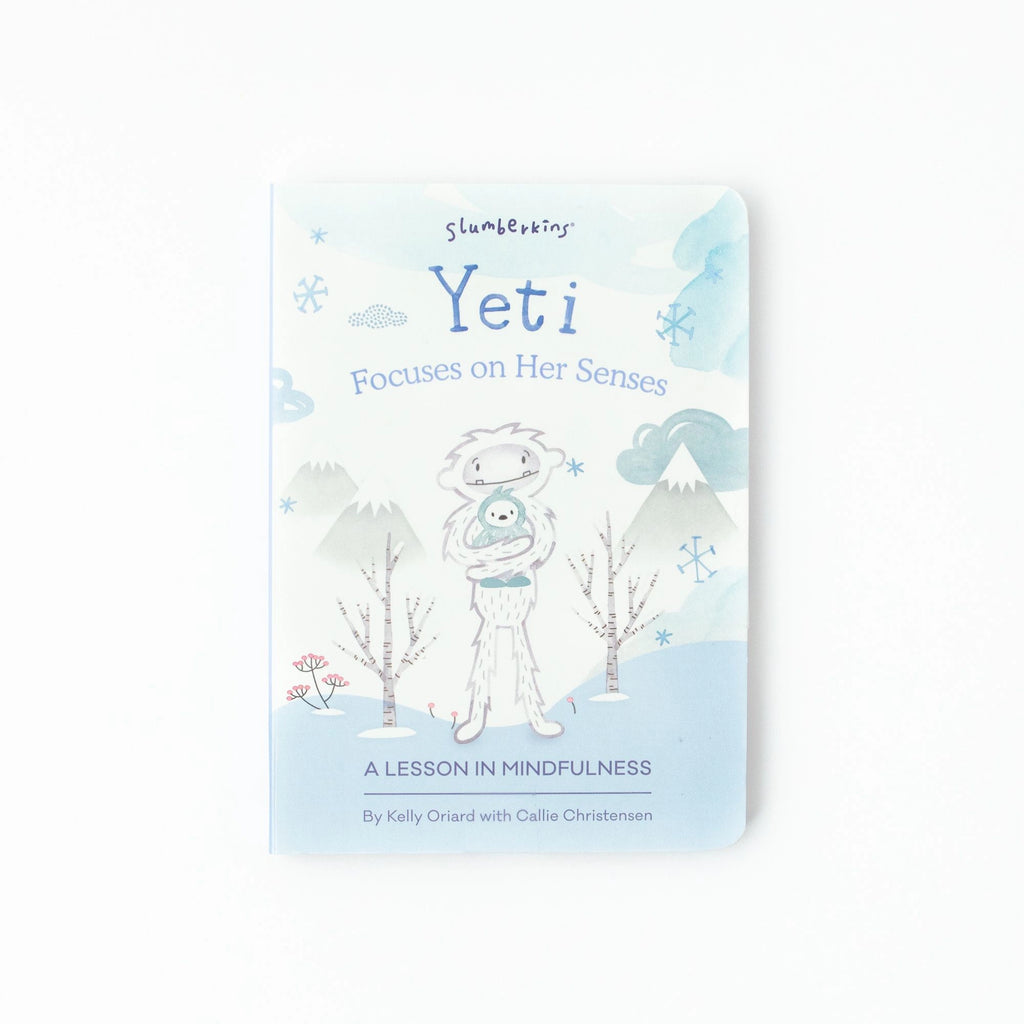 A book titled "Slumberkins A Lesson in Caring Board Book Set" by Kelly Oriard with Callie Christensen, featuring a cute yeti on the cover surrounded by snow.