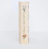 The spine of the Collector's Edition Hardcover of "Anne of Green Gables" features a white flower and a hat with ribbons on a light cream background.