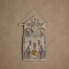 The Coral & Tusk Christmas Clock Advent Calendar is a decorative textile wall hanging shaped like a cuckoo clock, with embroidered trees, pine cones, and red-clad figures on a beige textured background.