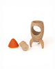 The Sabo Concept Rocket with Bear is a wooden space toy that comes apart into three pieces—an orange cone top, a cylindrical middle, and a round base with three legs—ideal for imaginative play.