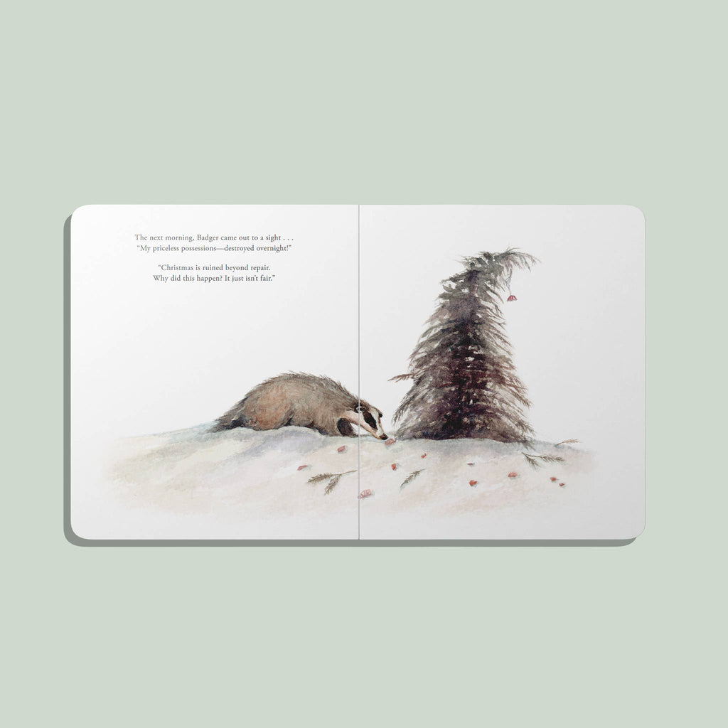 An illustrated spread from "Our Little Adventure at Christmas (Baby's first Christmas)" shows a badger lying on snowy ground by a tall pine, with footprints and pinecones nearby. The left page features a short passage for toddler language development.