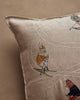 The Coral & Tusk Downhill Skiers Pillow is a beige embroidered pillow featuring animals in winter outfits, like a dog in an orange hat, skiing against a plain background for a charming scene.