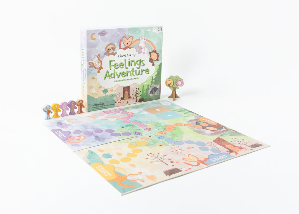 A children's cooperative board game called "Slumberkins Feelings Adventure Board Game" displayed on a white background. The game includes a colorful board, character pieces, a tree, and a booklet designed to help develop emotional