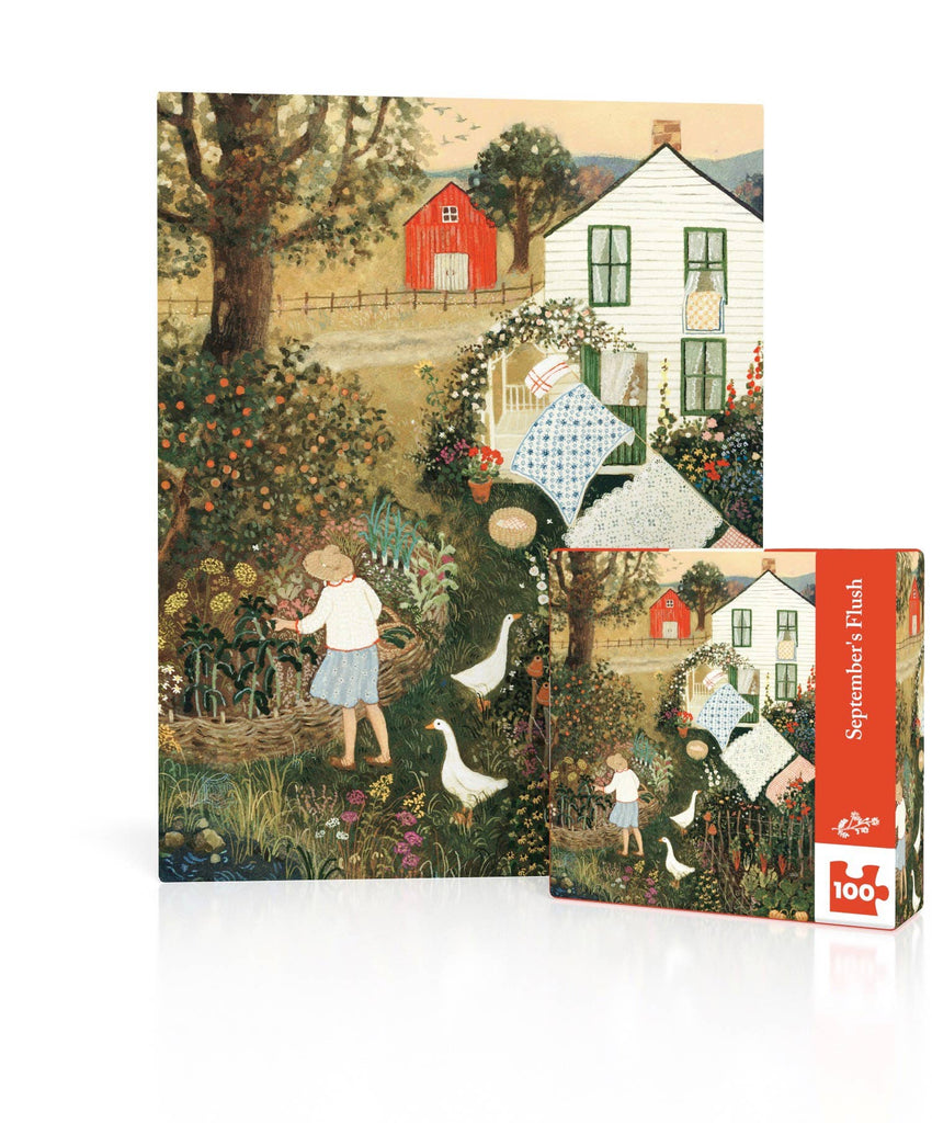 September’s Flush Mini - 100 Piece Mini Puzzle box next to the completed puzzle, featuring a Loré Pemberton folk-art painting of a woman gardening in a yard with two white geese, a farmhouse, and laundry drying on a line.