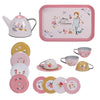 Moulin Roty Metal Tea Party Suitcase Set - The Parisiennes metal tea set for children, including a teapot, serving tray, four cups, and four saucers decorated with floral patterns and illustrations of a girl.