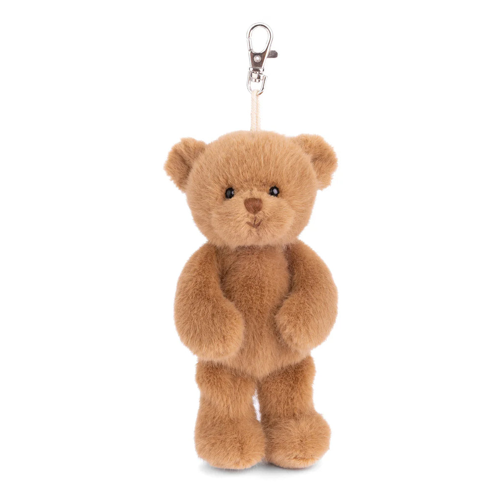 The Bukowski - Happy Mavi Bag Charm XL is a small plush bear keychain with a silver clasp on its head, standing upright against a white background—ideal as a cute, giftable accessory.