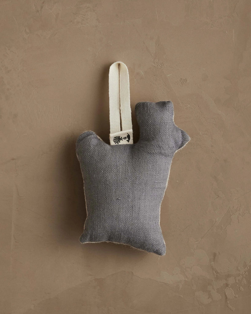 The Coral & Tusk Rudolph Ornament is a small, gray fabric stuffed toy shaped like a hand with a raised index finger and a white loop—a cute Christmas tree decoration—shown against a textured beige background.