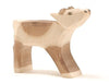 An Ostheimer Reindeer Calf with a simple, minimalist design. The reindeer calf is painted in light and dark brown patches, mimicking natural patterns. Its features are carved in blocky, geometric shapes, giving it a rustic and handcrafted appearance perfect for imaginative play.