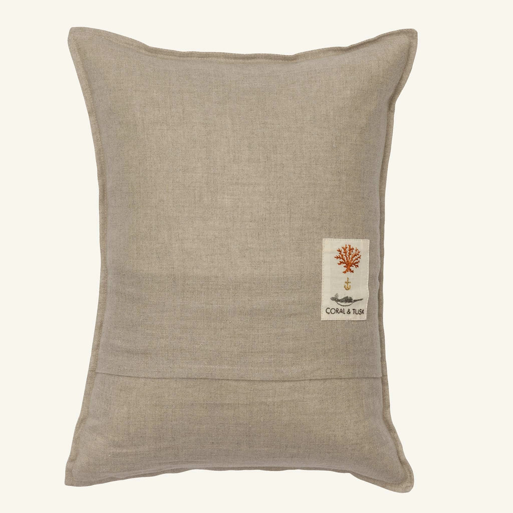 A rectangular beige linen pillow with a small embroidered orange coral patch and "CORAL & TUSK" text—perfect Easter decor or for pairing with the Coral & Tusk Sugar Egg Pocket Pillow.