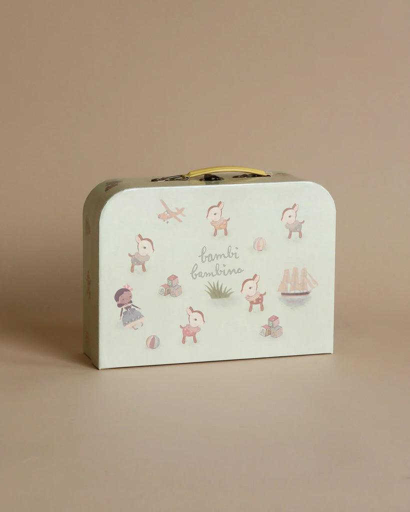 A small, rectangular Maileg Starter Set - The Parents with a curved top, featuring whimsical illustrations of pink elephants and various childhood items like toys and a rocking horse, set against a soft beige background with scattered small parts.