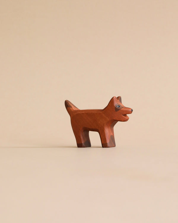 A high-quality Handmade Holzwald Brown Dog figurine with a simplistic design, standing upright on a plain beige background.