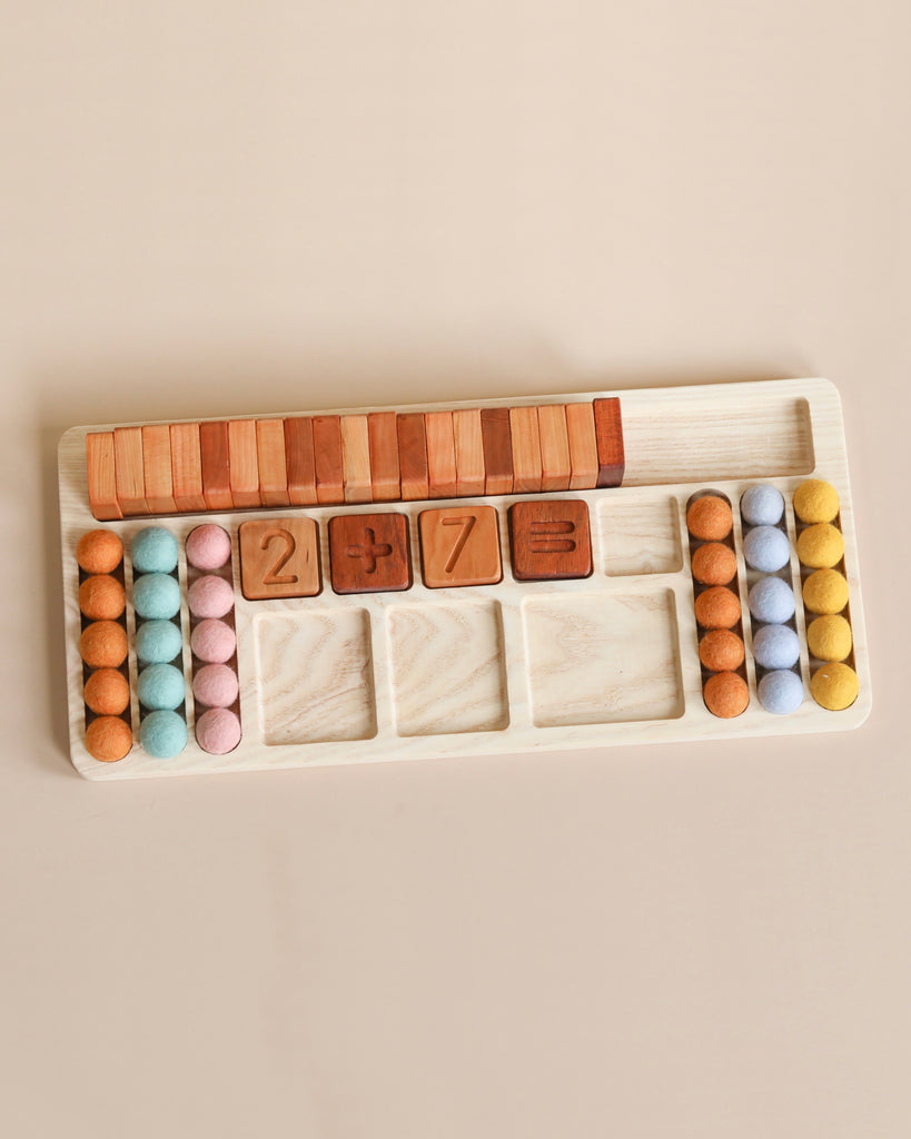 Wooden educational toy featuring The Original Extended Math Board - Made in USA with colorful felt balls and number blocks on a beige background.