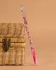 The Konges Sloejd Magical Glitter Wand - Pink Mix is a sparkling, wand-shaped box with pink liquid—ideal for kids who love imagination and a touch of glittery magic.
