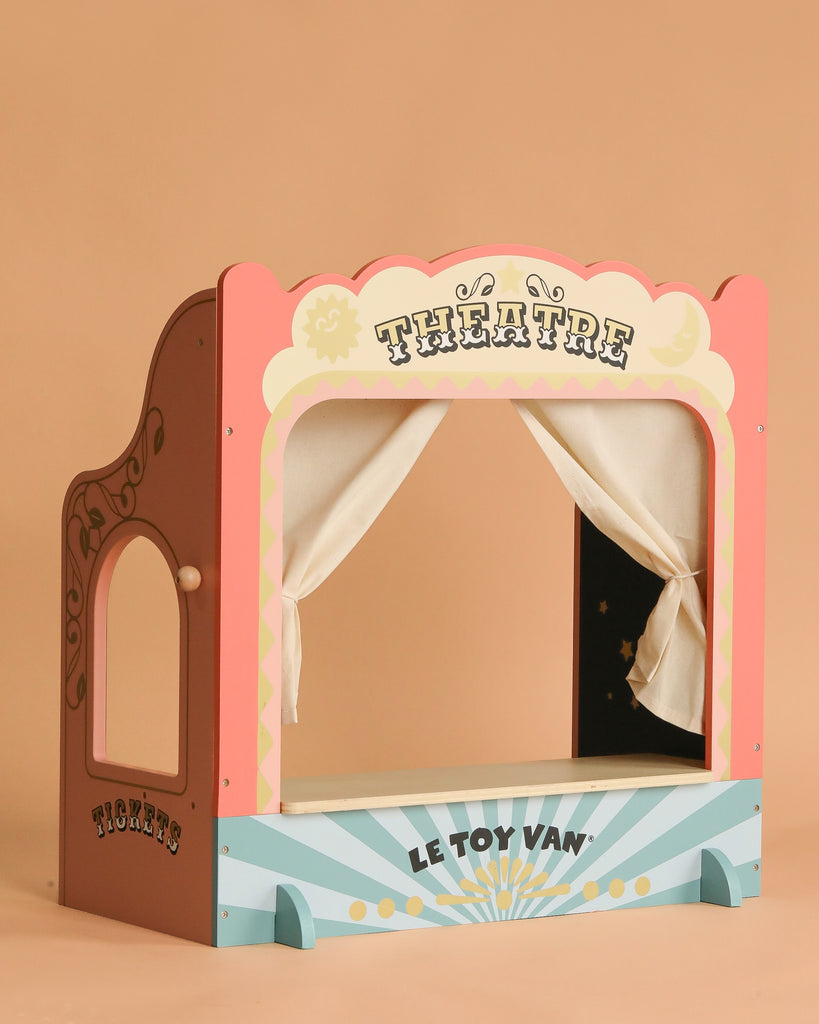 The Maileg Family Theater Set is a vibrant wooden puppet theater with white curtains and a side ticket booth—ideal for showcasing your Maileg mice or as the centerpiece in your Maileg dollhouse furniture collection.