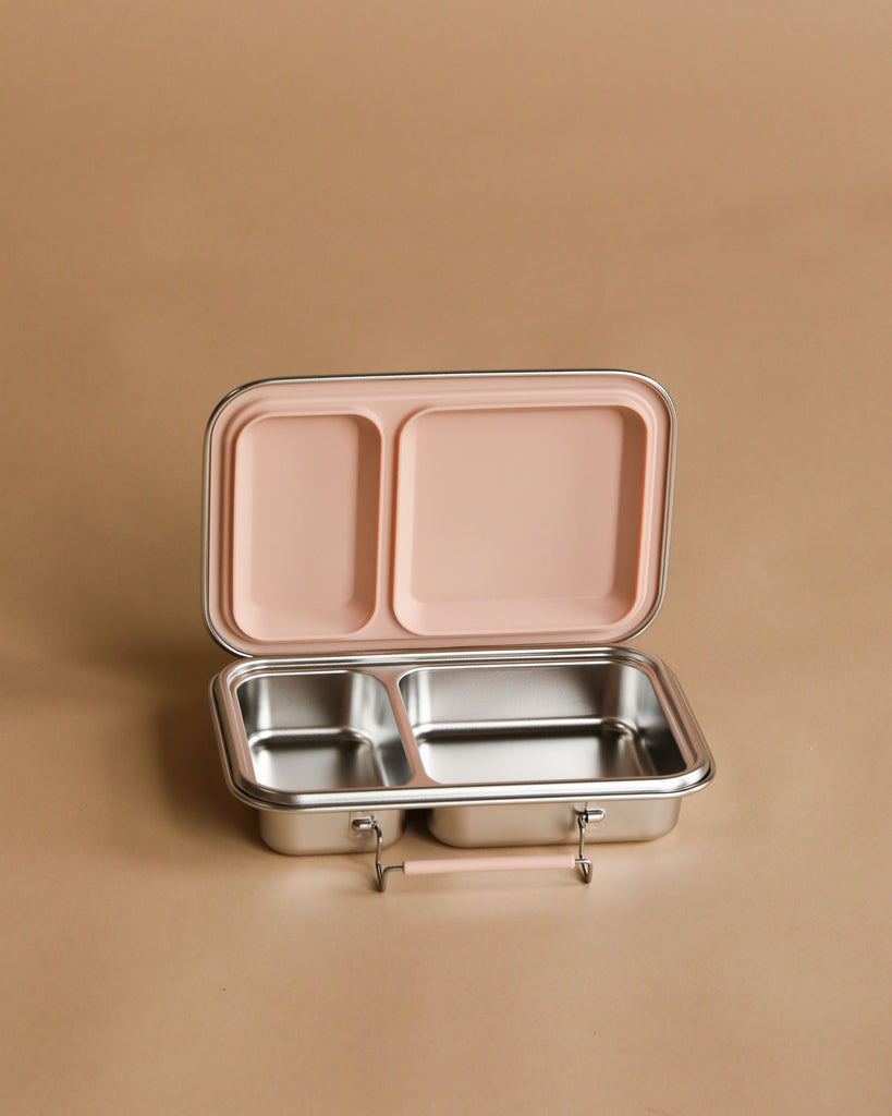 The Haps Nordic Stainless Steel Lunch Box with two compartments and a blush lid is open and displayed on a plain beige background.