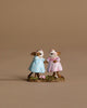 The Wee Forest Folk Tiny Collectible - Funny Friends features two small hand-sculpted mice in blue and pink pastel dresses standing side by side, holding hands on grass. Handcrafted in Carlisle, MA. Not a toy.