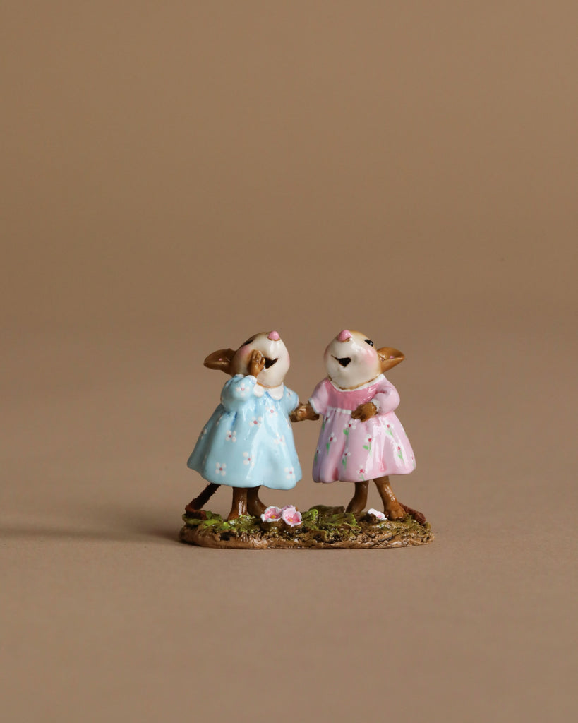The Wee Forest Folk Tiny Collectible - Funny Friends features two small hand-sculpted mice in blue and pink pastel dresses standing side by side, holding hands on grass. Handcrafted in Carlisle, MA. Not a toy.