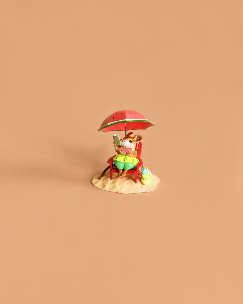 The Wee Forest Folk Tiny Collectible - Perfect Beach Day! (Not a Toy) features a hand sculpted mouse at a table under a red umbrella with a drink and bag on sandy base, set against a plain beige background.