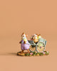 The Wee Forest Folk Tiny Collectible - Easter's on its Way features a hand-sculpted mouse in overalls pulling a cart with two baby mice on a flower-adorned base, perfect for collectors. Not a toy.