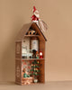 The Maileg Gingerbread House Christmas Set features a mouse in a red outfit atop the house, another by the Christmas Tree inside, plus miniature furniture and festive décor filling every cozy room.