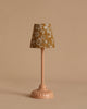 A Maileg Nursery Set featuring a vintage-style table lamp with a pink base and brown floral shade sits beside a charming Maileg Mouse, all against a plain beige background.
