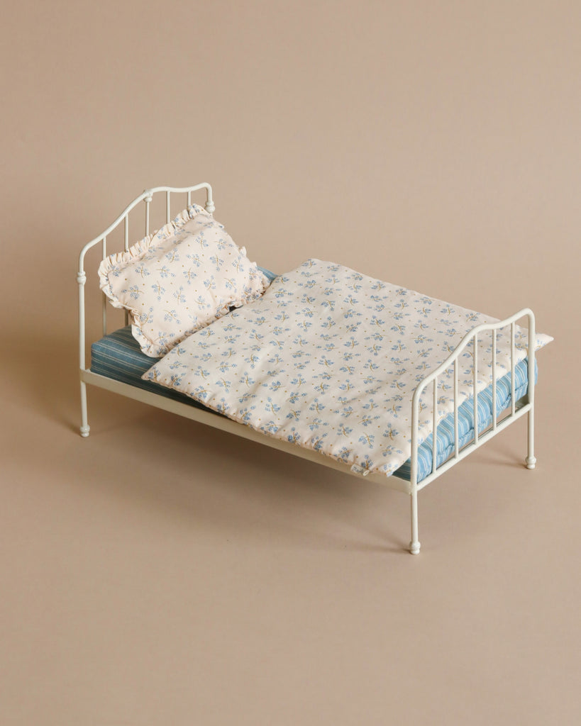 Toy blue doll bed