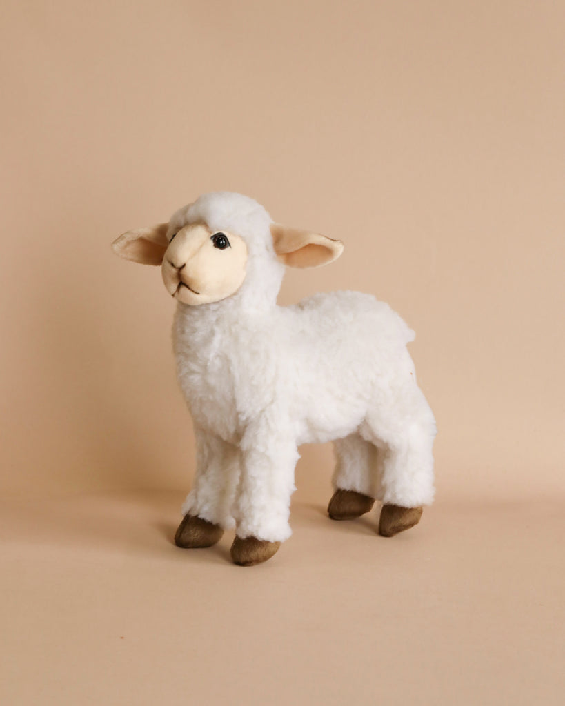 A Lamb Stuffed Animal standing on a plain beige background, featuring high-quality man-made materials for its soft white fur and adorable innocent eyes. The stuffed animal has brown hooves and a gentle expression.
