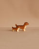 The Handmade Holzwald Dachshund Dog, Small, is a charming sustainable wooden toy that adds warmth to any space—perfect for display or play.