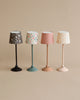 Four Maileg Miniature Floor Lamps - Tall with patterned shades, aligned in a row against a neutral background. Each lamp features a different color and pattern on both the base and shade.