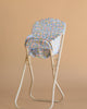 The Konges Sloejd High Chair - Rose Flower is a beige metal foldable doll chair featuring a seat and backrest covered in blue floral-patterned fabric, shown against a plain beige background.